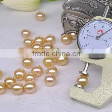 Natural 13-14mm perfect round golden south sea pearl price