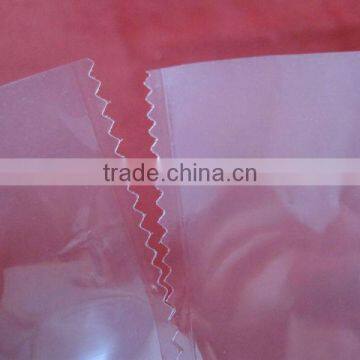 Back-sealed plastic bag with sawtooth