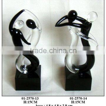 black and clear glass figures