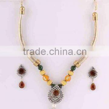 Indian manufactured multi gemstone studded necklace set party wear drop earrings jewelry. Brass metal.