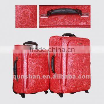 red color trolley luggage