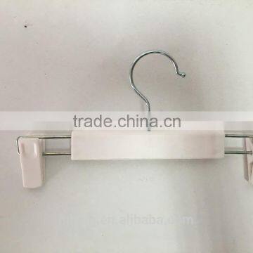 white hook clothes hangers with plastic clips