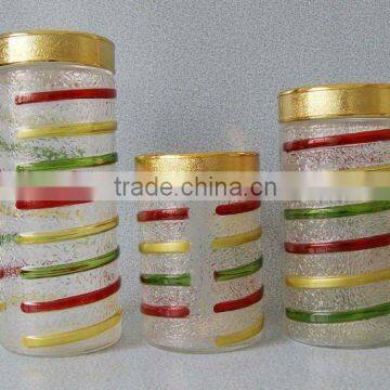 Hand drawing colored glass canisters