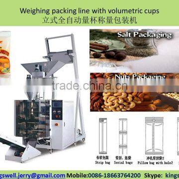 Packing machine with volumetric cups