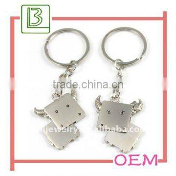 cow shaped metal couple key ring