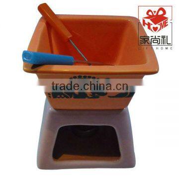 ceramic chocalate fondue pot with fork