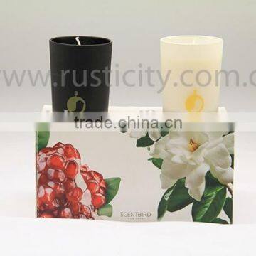 Eco-friendly scented candles in black and white glass jars