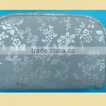 cosmetic case with grey flower on surface for ladies