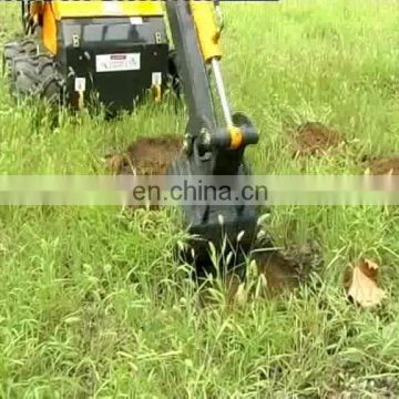 Small skip loader with mower, tiller and various attachments