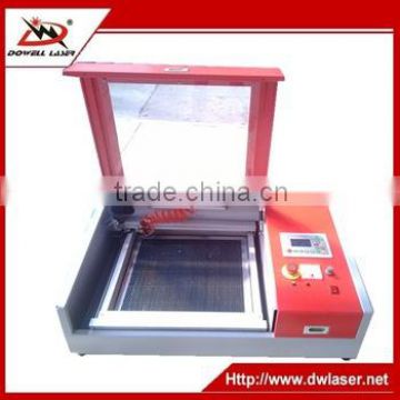 China Jinan DW-5030 lowest price mini co2 laser engraving and cutting machine on wood plastic crystal