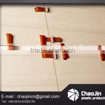 Plastic tile cilp leveling system