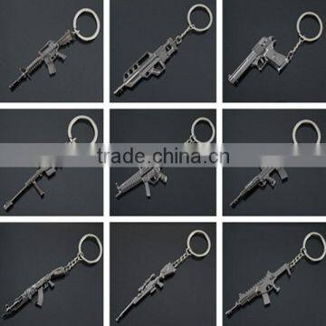 new fashion custom cheap metal war fighting gun pom pom keychain