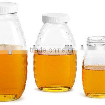 Clear glass honey jar