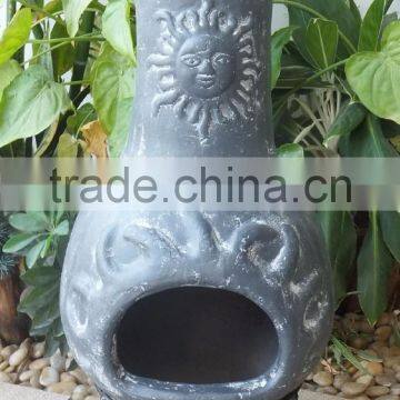 Outdoor sunset clay chimenea in grey color