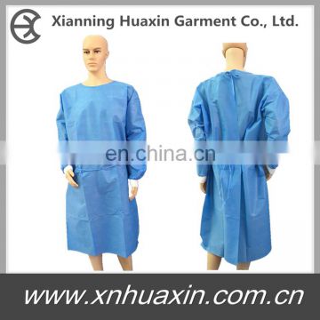 Disposable blue patient gown with knitted cuffs