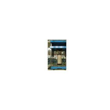 Transformer coil trueing (reshaping) machine