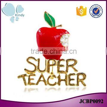 Gold plated zinc alloy rhinestone super teacher enamel Christmas apple brooch