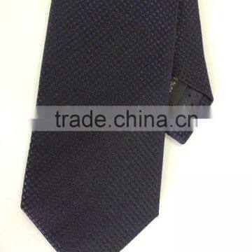 Men's 100% silk tie with navy dot design