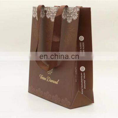 Luxury Custom Logo Gold Foil Printed White Cloth Paper Packaging Bag With Handle photo-3