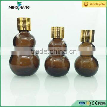 Hot selling brown double gourd shape glass essential oil bottle