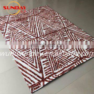 Machine knitted shaggy rug with micro fiber