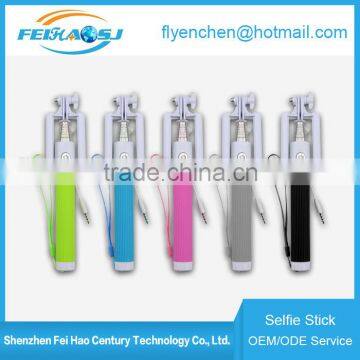 2016 hottest hand held monopod wired selfie stick with foldable holder for phone