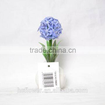 Artificial flower planted in ceramic pot for home decoration