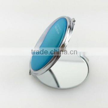 Small round metal pocket mirror