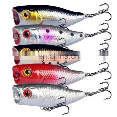 Popper baits wave climbing floating water surface