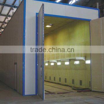 Q26 series best price , warranty steel grit/sand blasting room for large parts surface cleaning