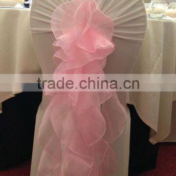 pink spandex chair cover with lace sash for wedding