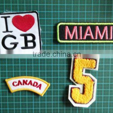 wholesale and new style iron on patch , embroidered patch for garment decoration