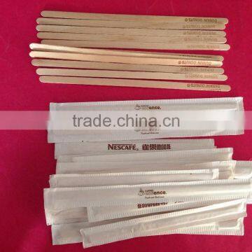 white paper wrapped wooden coffee stirrers