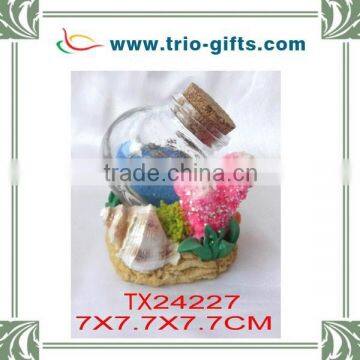 Hot selling glass bottle with polyresin design decorative