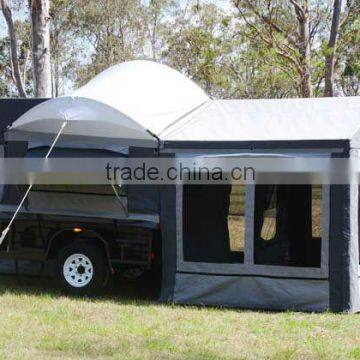 Canvas trailer tent with tropical roof