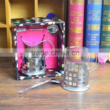 Glass coffee mug with stainless steel base handle