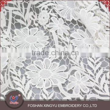 Hot sale promotional cheap embroidery supplies net dress materials fabric designs for clothes