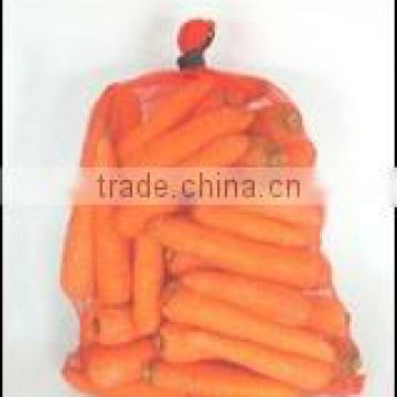 Orange mesh bag for carrot