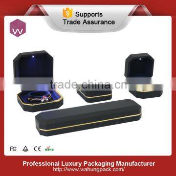 plastic with lacquer black led jewel set box with gold frame