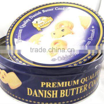 small round tin container/ biscuit can