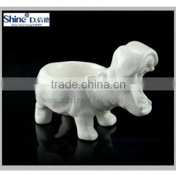 white ceramic rhino shaped mini tea light candle holder for ceremony