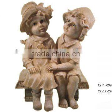 Resin boy and girl figurines