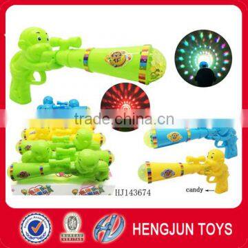 China candy toy monkey sound gun flashing light and sound toys gun with candy 10 pcs