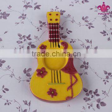 Tea light ceramic candle holder with guitar design