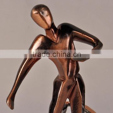 Graceful man playing football resin statue