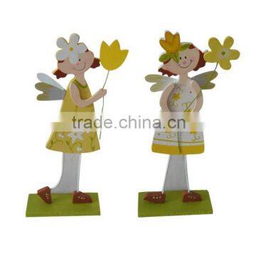 Easter Wooden girl with flower for home decoration on topdesk