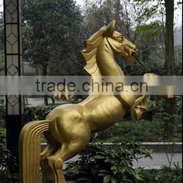 Large gold bronze finished metal horse sculpture jump standing