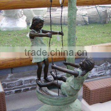 Bronze boy and girl swing garden statue