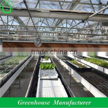 Greenhouse cooling pad and fan