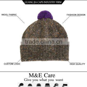 Grey wool beanie hats with a ball